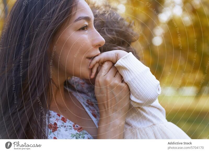 Ethnic mother and daughter bonding in Californian park ethnic affection california nature love family serene connection embrace outdoor maternal child woman