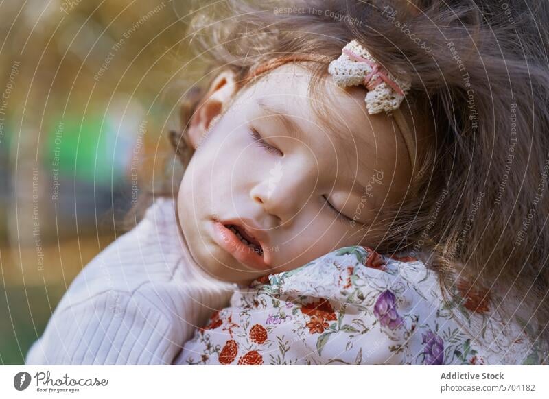 Ethnic mother holding sleeping daughter in park child cradle ethnic family love tender embrace nature peaceful eyes closed care affection bond maternal female