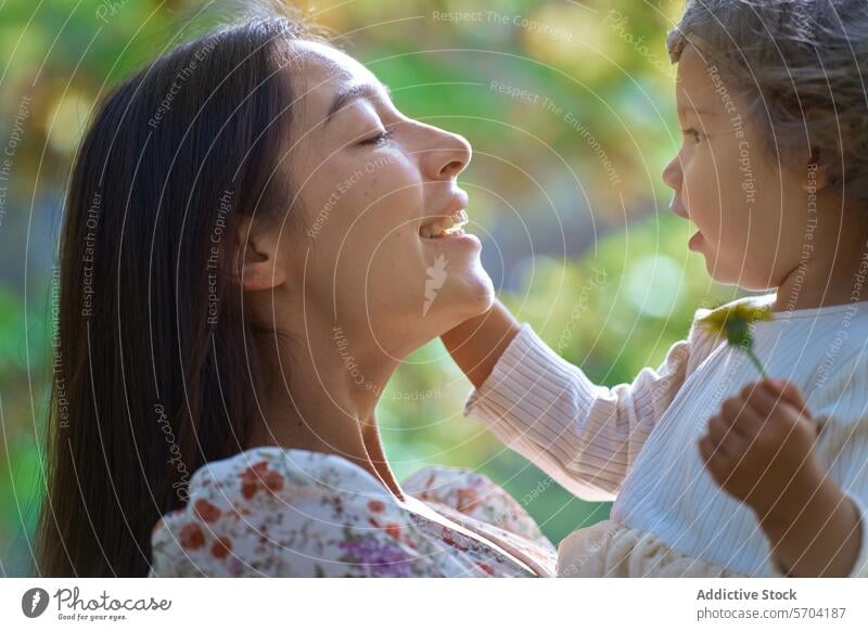 Diversity and joy as mother and daughter bond in nature family bonding ethnic park california usa love happiness connection outdoors serenity sunlight flora