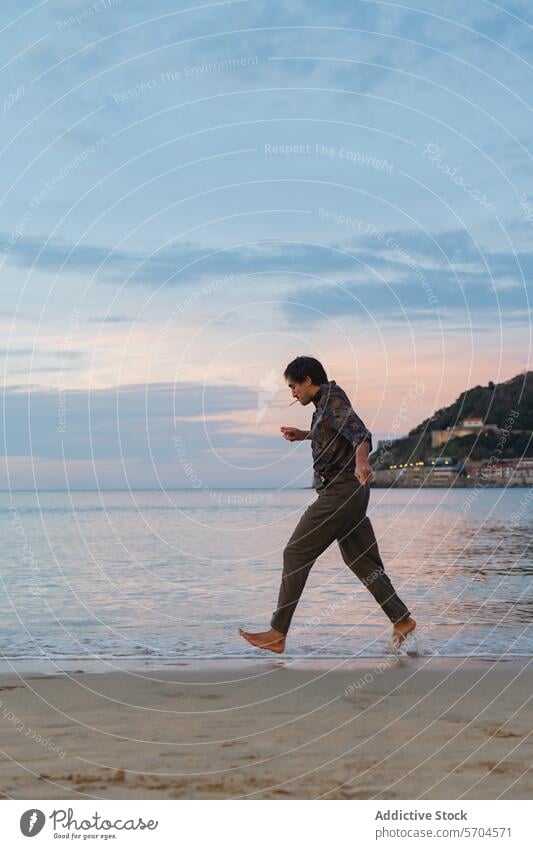 Man walking barefoot on a tranquil beach at dusk man shore ocean wave gentle lapping feet pastel sky peaceful stroll leisure relaxation tranquility alone sand