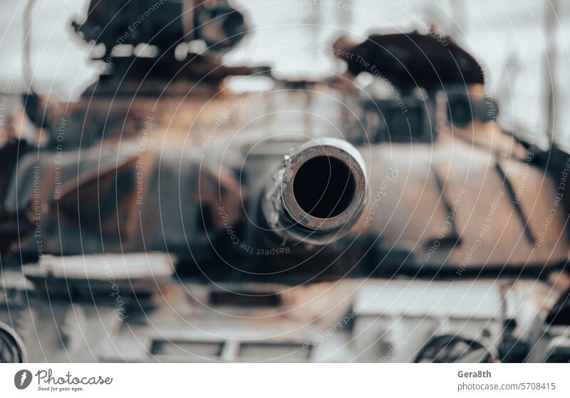 damaged military tank on a city street in Ukraine Donetsk Kherson Lugansk Mariupol Russia Zaporozhye abandon abandoned armor attack bakhmut blown up bombardment