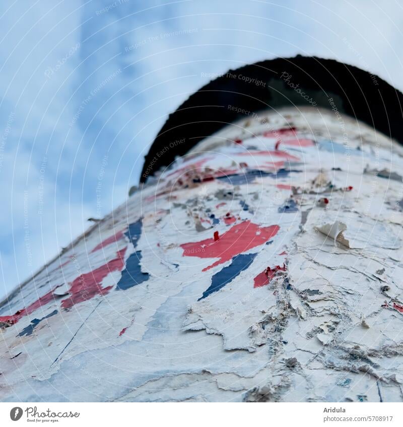 Paper layers on an advertising pillar Advertising column Poster Posters Broken Structures and shapes Close-up Trashy Billboard Transience torn Old Decline