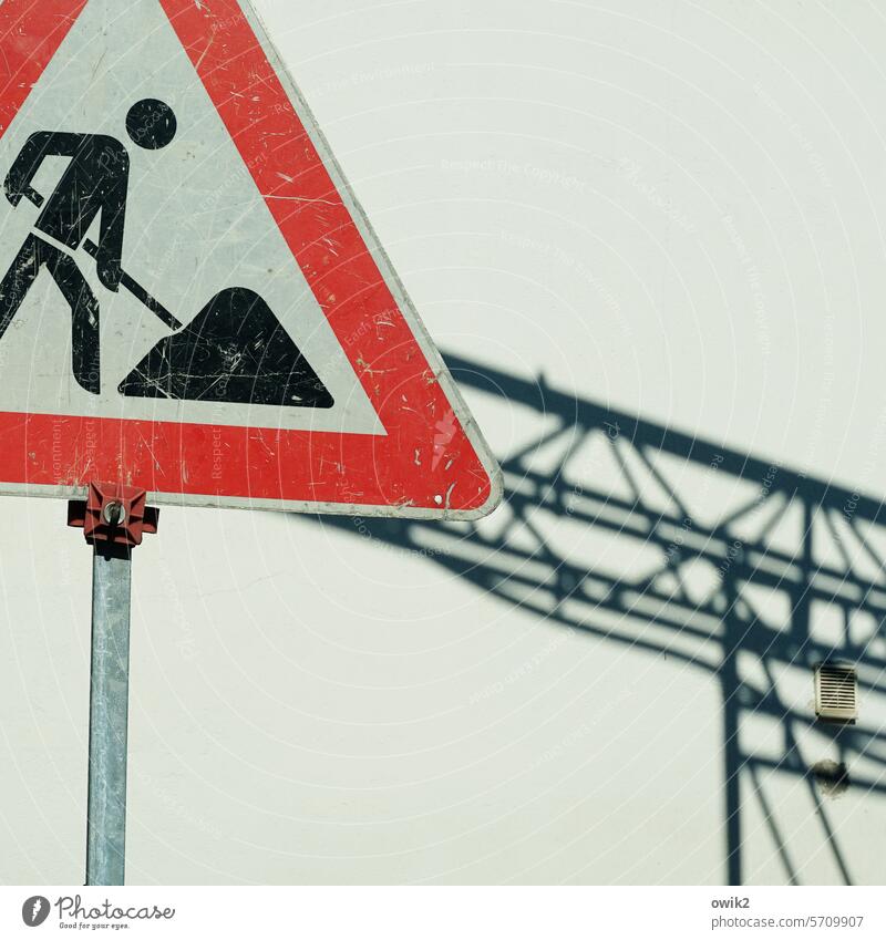 Construction diary Construction site Signs and labeling Detail Construction crane Shadow Sunlight white wall Contrast Silhouette Construction worker Pictogram