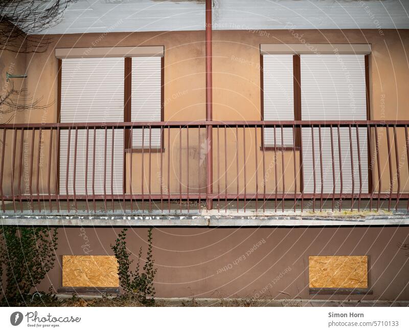 Barricaded residential units in a vacant building Closed Apartments invisible forsake sb./sth. Vacancy Change Gloomy Building Old Uninhabited Facade shutters