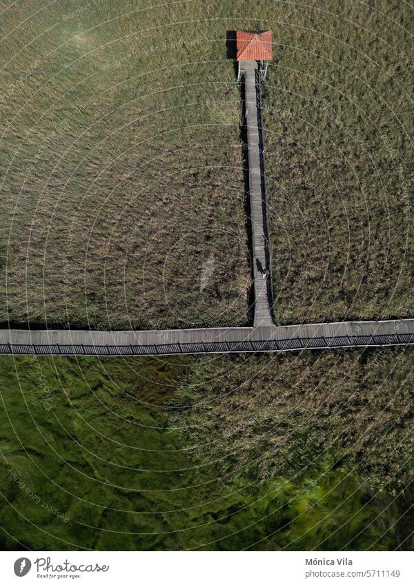 aerial view. Wooden walkway in the Ulla River wetland in Torres do Oeste, Catoira wood path nature green grass stroll river galicia Pontevedra landscape travel