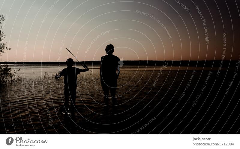 prefer to live unusually - fishing in a reservoir with a child Woman Silhouette Depth of field Reservoir Lake Stand Boy (child) Cloudless sky Nature