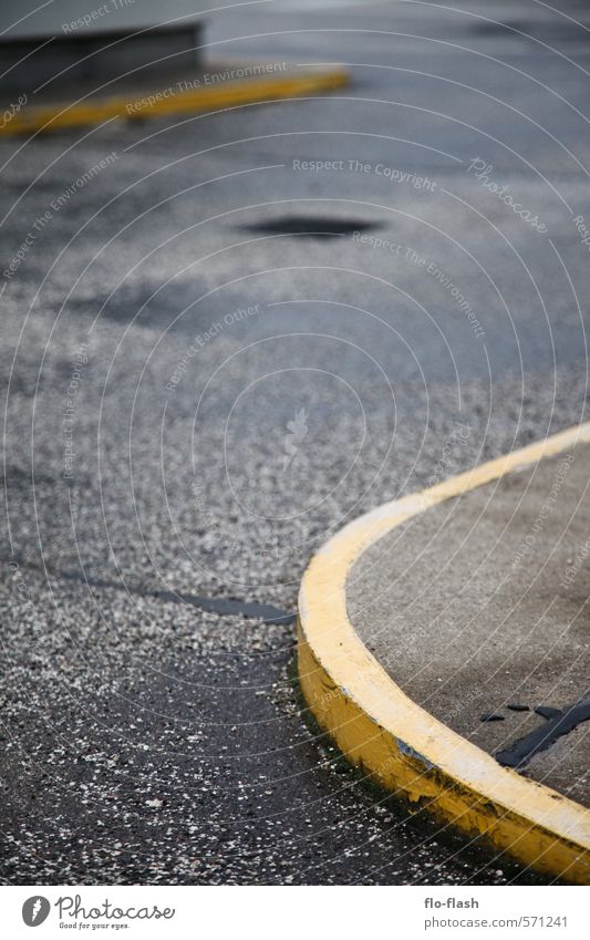 yellow round corners Town Port City Industrial plant Parking garage Street Lanes & trails Dirty Authentic Sharp-edged Gloomy Gully Curbside Colour photo