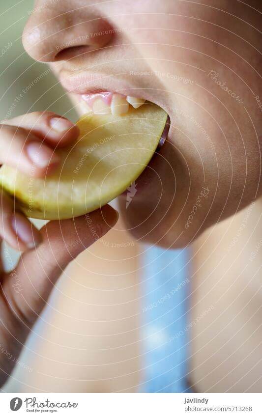 Crop teenage girl biting fresh juicy apple slice at home Girl Bite Apple Fresh Juicy Slice Healthy Vitamin Fruit Nutrition Eat Food Delicious Yummy Teen Tasty