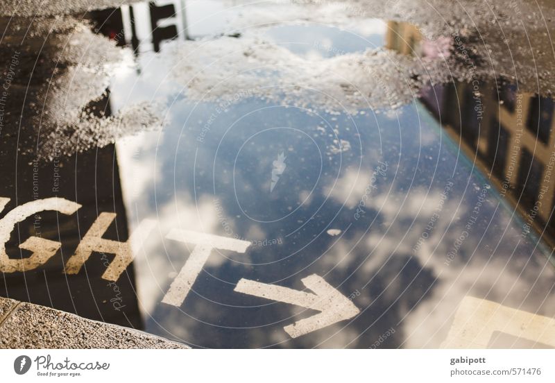 ght London Town Capital city Pedestrian Street Crossroads Lanes & trails Road junction Road sign Arrow Puddle Reflection Warning label Clouds Colour photo