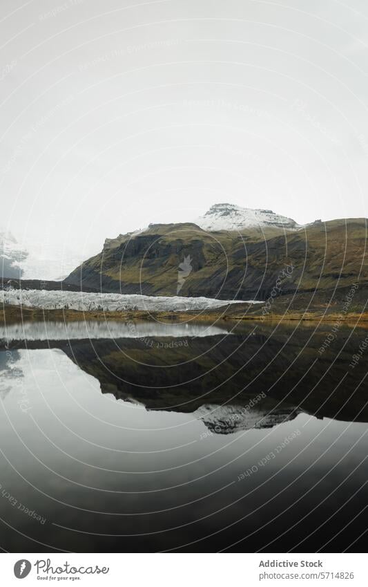 Mystical glacier reflection in Iceland's serene landscape iceland water mountain nature cold tranquil mist overcast cloudy peaceful wilderness remote travel