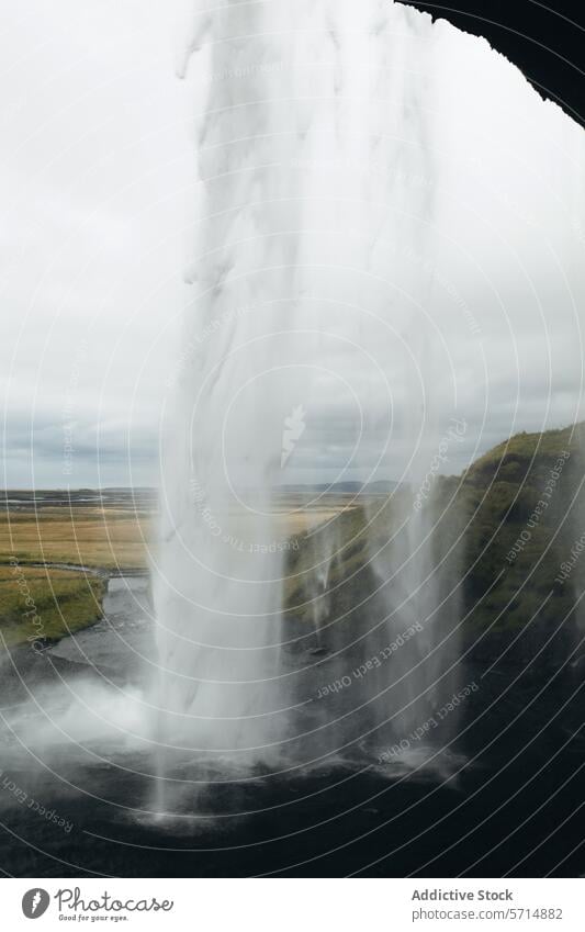 Generated image seljalandsfoss waterfall iceland landscape nature cascade mist scenic travel tourism behind view natural beauty icelandic landmark outdoor