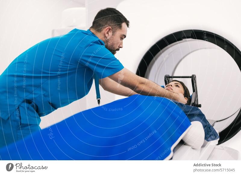 Medical professional preparing patient for CT scan healthcare medical technician ct scan computed tomography hospital clinic assistance preparation