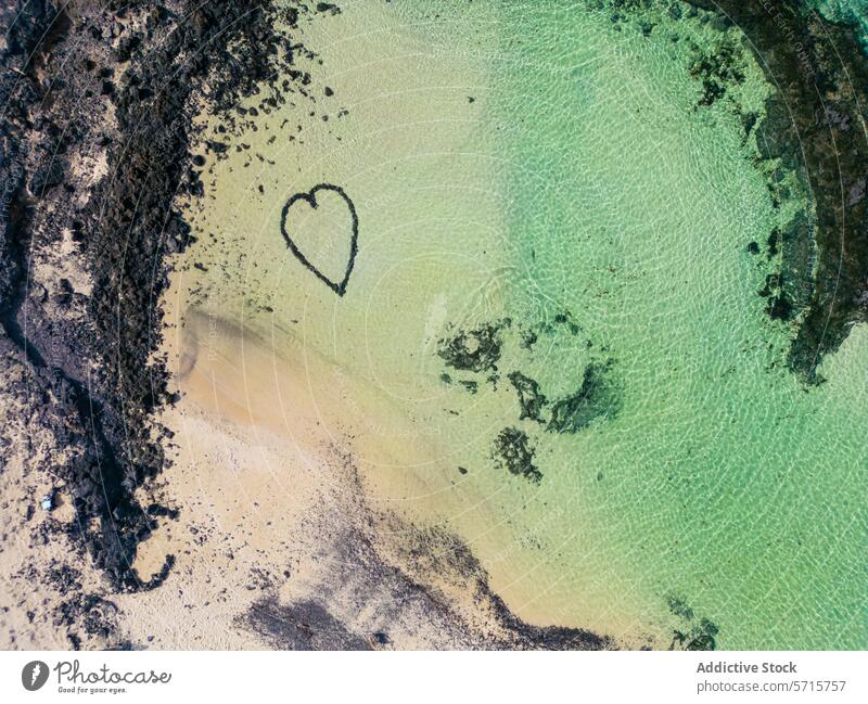 Heart on the Beach at Calderon Hondo Volcano, Fuerteventura aerial view beach heart shape mark natural water clear crystal calderon hondo volcano fuerteventura