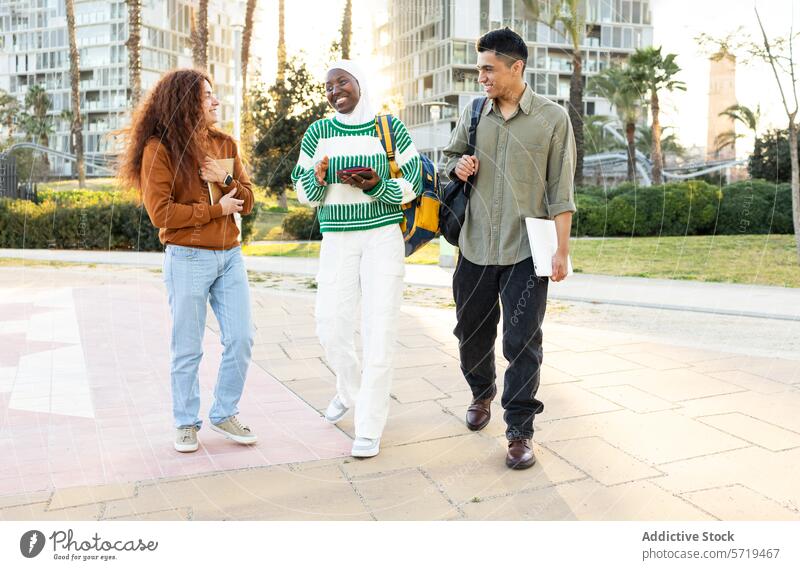 Diverse Group of Students Walking and Talking Outdoors student conversation walkway sunny campus diversity friendship young adult african american woman