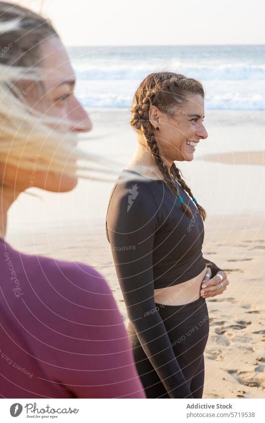 Smiling women enjoying a yoga session on the beach woman sunset class smile joyful peaceful sandy backdrop stunning leisure activity outdoor fitness health