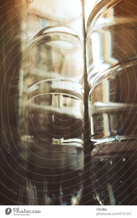 Two water bottles stand on the table and reflect each other, view of the window Bottle of water Water stayhydrated Environment Protection