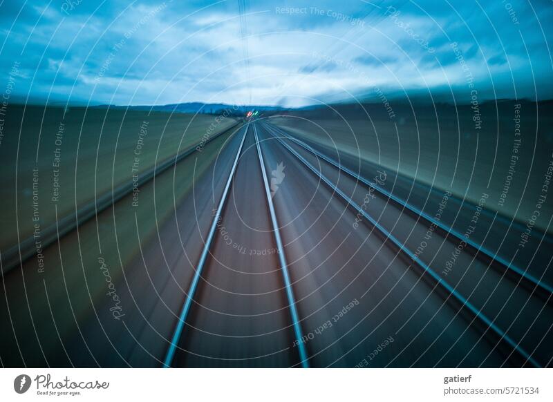 Journey through the Wetterau at dusk by train between Butzbach and Bad Nauheim high speed Exterior shot Speed Deserted Colour photo Transport Long exposure