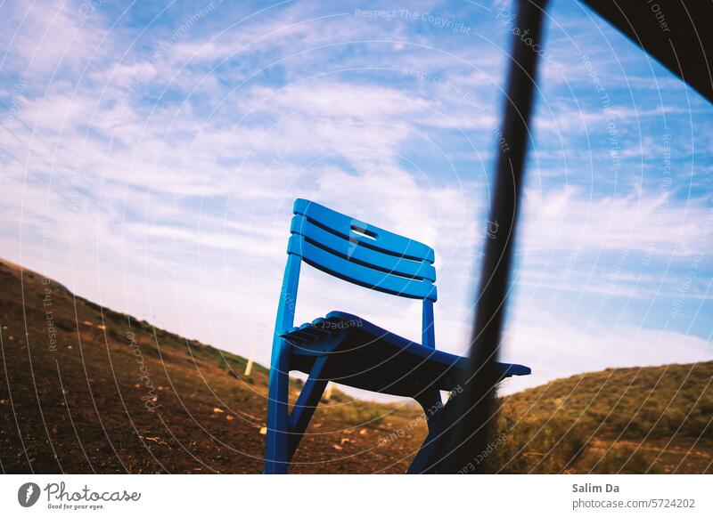 Blue chair matching the blue natural cloudy sky Blue sky blue background Chair chairs blue skies Sky Skyline Match Clouds Clouds in the sky cloudscape