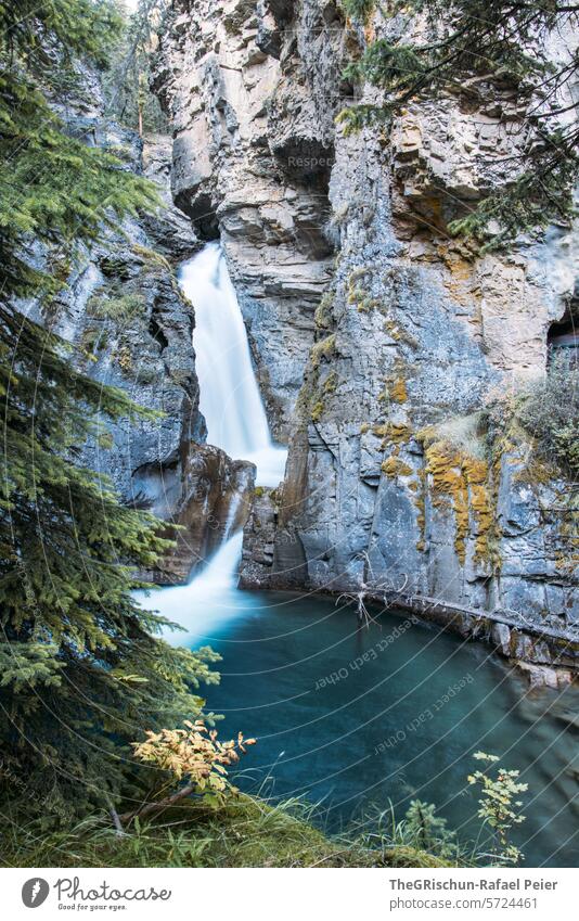 Long exposure of waterfall in a gorge Water Canyon Brook Blue stones Rock Landscape Flow running water flowing water Nature River Day Exterior shot Outdoors