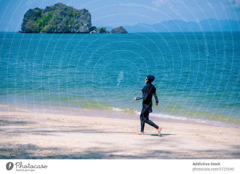 Woman in Burkini Enjoying a Beachside Run beach woman burkini run sea island swimwear modest muslim sunlit athletics sand coastal blue waters outdoor activity