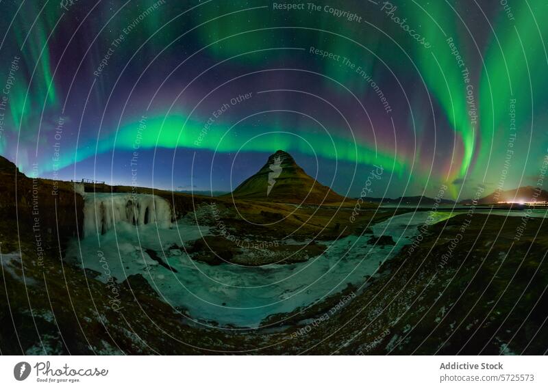 Northern lights spectacle above Kirkjufell, Iceland aurora borealis northern lights kirkjufell iceland mountain waterfall frozen landscape night sky