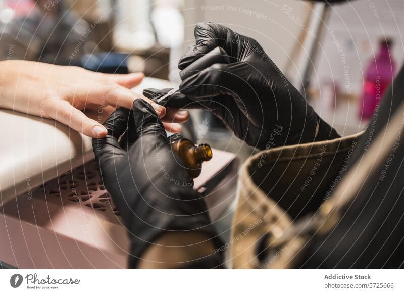 Close-up of manicure process at a nail salon cuticle oil professional manicurist client nail care beauty treatment hand close-up hygiene cosmetic service