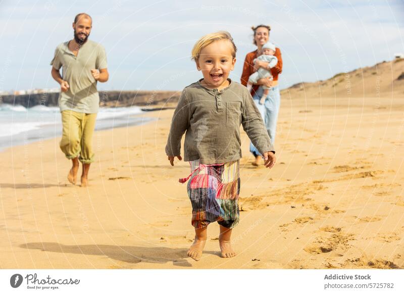 Joyful family moments on a sunny beach day fun play run child parent shore sand coastal leisure vacation happiness joy outdoor seaside summer casual lifestyle