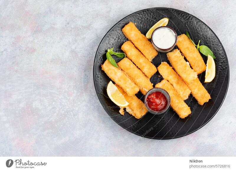 Fish fingers or nuggets, seafood. fish stick fish nuggets fried snack dinner sauce appetizer crispy breaded fish finger golden fillet dish lemon prepared