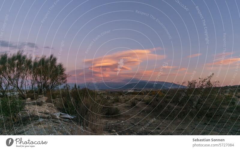 Landscape of Sierra Nevada mountains with lenticular clouds during sunset near Granada, Andalusia, Spain landscape sky scenery nature peak view travel scenic