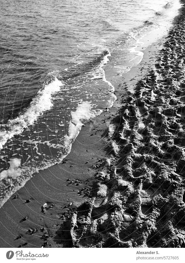 Beach with waves and footprints Waves bank Water Ocean coast Sand Sandy beach Vacation & Travel Relaxation Summer vacation Tourism Baltic Sea Baltic beach