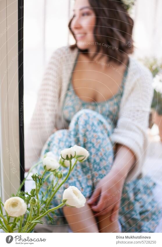 romantic portrait of woman in summer dress and white ranunculus flowers bouquet floral beautiful background spring bunch decoration bloom wedding bud clothes