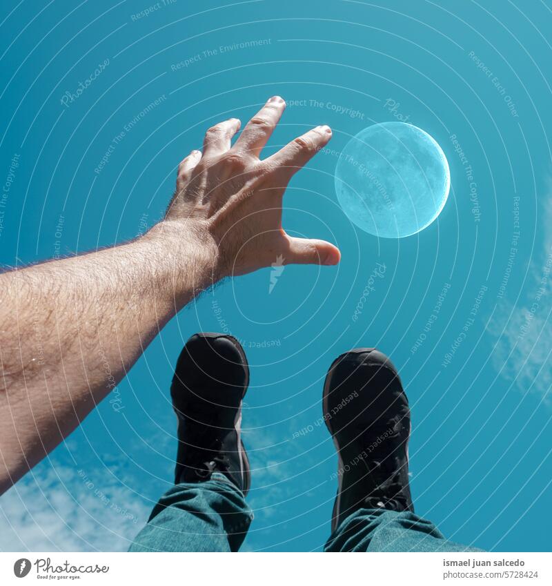 hand and feet in the blue sky reaching the moon Hand body part foot Feet hand up Arm arm raised Feet up Sneakers Legs Blue sky Sky Moon Reach gesturing Summer