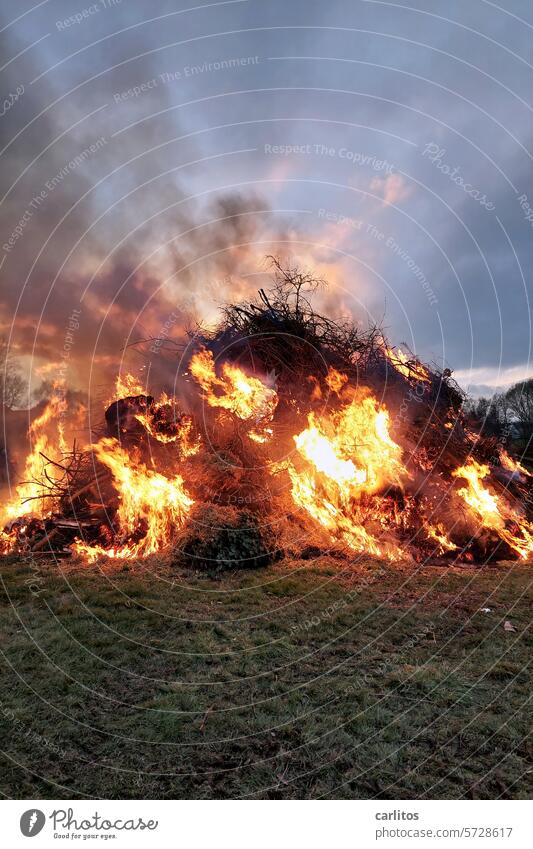 Easter celebration at Osterfire I Easter fire voluntary fire brigade Beer Small sausage Booze Warmth Spark flying sparks peril Fire hazard Risk of accident