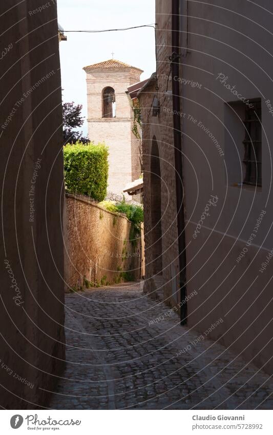 Historic buildings of Montefalco, Umbria, Italy Europe Perugia alley arch architecture city cityscape color exterior facade historic house old outdoor