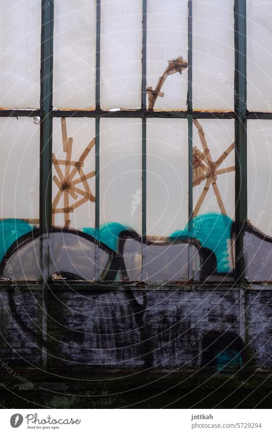 A makeshift window patched with adhesive tape and covered in graffiti Train station Germany Duisburg Central station The Ruhr Graffiti Adhesive tape dilapidated