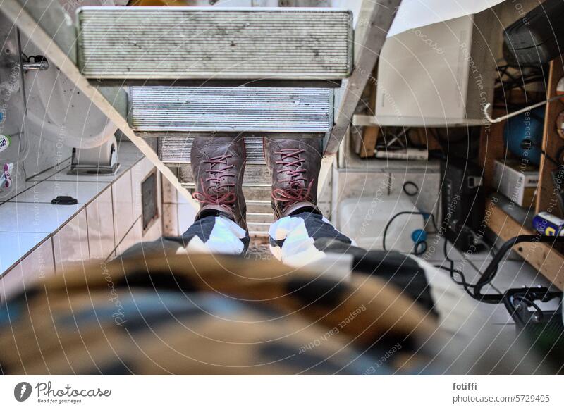 Man standing on ladder in tiny, cluttered bathroom | Allotment chaos Ladder Downward Bird's-eye view Stairs Upward Climbing Attic Above Junk Ascending Go up