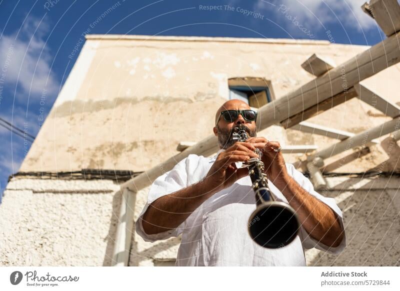 Musician Playing Clarinet Outdoors for Jazz International Day musician clarinet playing jazz international jazz day outdoor man male performance bald beard