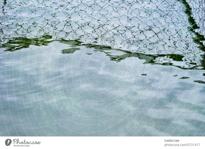 Wire mesh reflected in the water Wire netting fence Fence Shadow Shadow play Bright sunny Structures and shapes mirror Line Blue Barrier Protection Wire fence