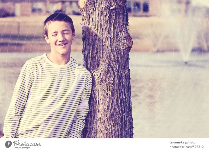 Handsome teen smiling with eyes closed. Young man Youth (Young adults) 1 Human being 8 - 13 years Child Infancy 13 - 18 years Landscape Smiling Lean Happy