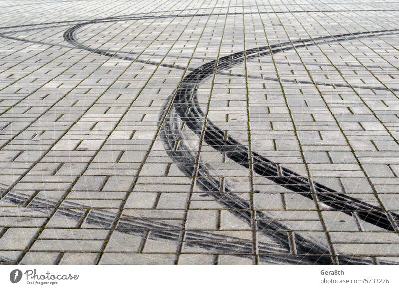 black marks of braking tires on car wheels on the road abstract architecture asphalt auto automobile background bend black tracks block boulevard braking lanes