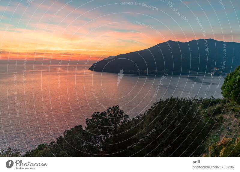 Moneglia in Italy liguria italy ligurian riviera riviera de levante bay ligurian sea mediterranean coast town hill evening sunset sundown dusk dawn slope