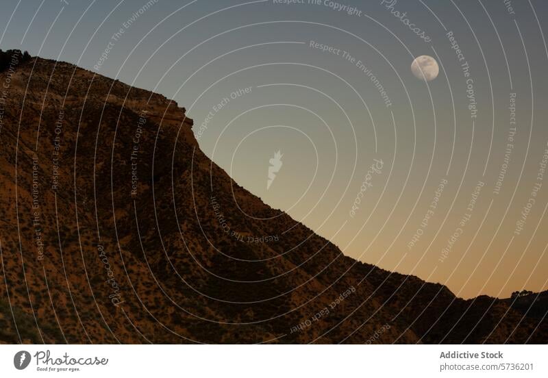 Moonrise over PeÃ±a del Ãguila in Guadalajara (600789) moon peÃ±a del Ã¡guila guadalajara twilight ridge mountain scene tranquil spain landscape dusk sky