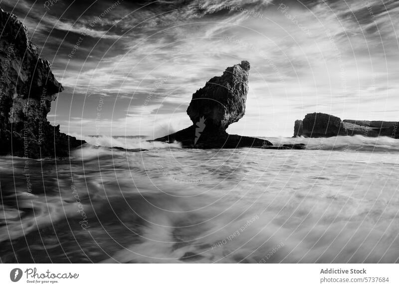 Monochrome seascape of Playa Buelna, Asturias, Spain monochrome playa buelna wave rock formation textured sky asturias spain black and white coastline dramatic