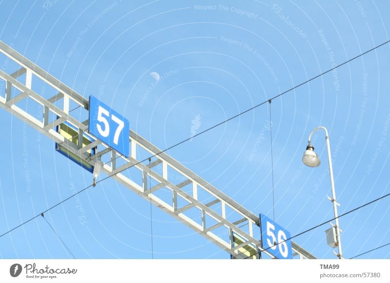 57 with moon + lamp Lamp Overhead line Railroad tracks Street lighting Moon Blue Sky Blue sky