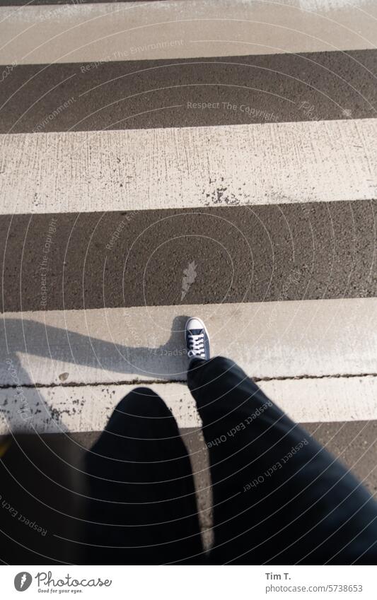 walk across a crosswalk Zebra crossing Berlin Chucks Going Legs Exterior shot Human being Footwear Street Town Colour photo Feet Day Pedestrian Walking