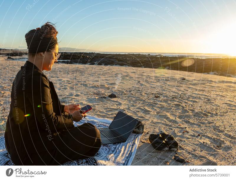 Remote female Work on a Beach at Sunset beach sunset digital nomad woman remote mobile phone work laptop smartphone sand technology ocean horizon leisure