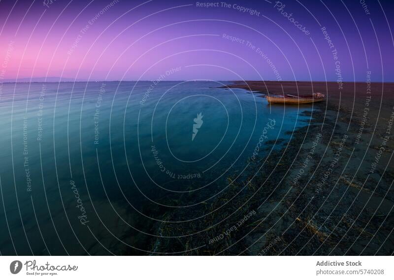 A serene dusk settles over Delta del Ebro, with a solitary boat resting on the gradient of blue to purple waters at low tide twilight serenity nature landscape