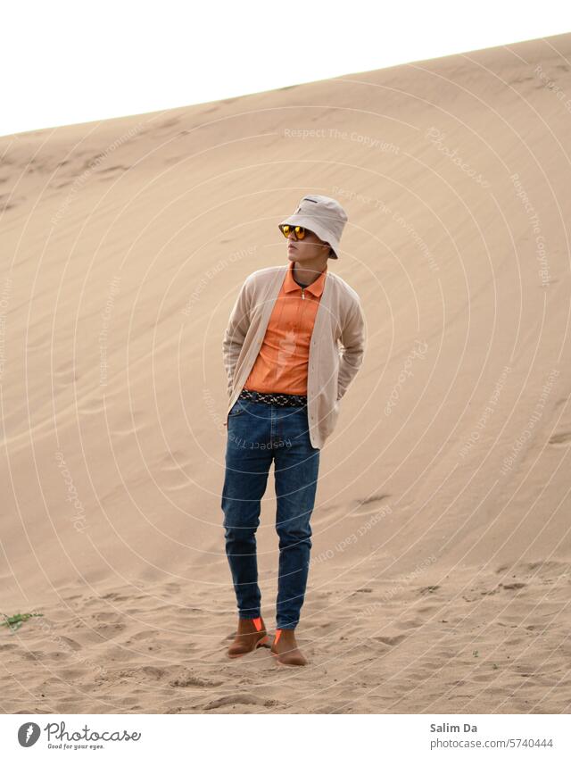 Staying stylish in the sandy desert Sand Style Desert deserts Deserted desert landscape Fashion fashionable Model Exterior shot Nature Natural naturally styled