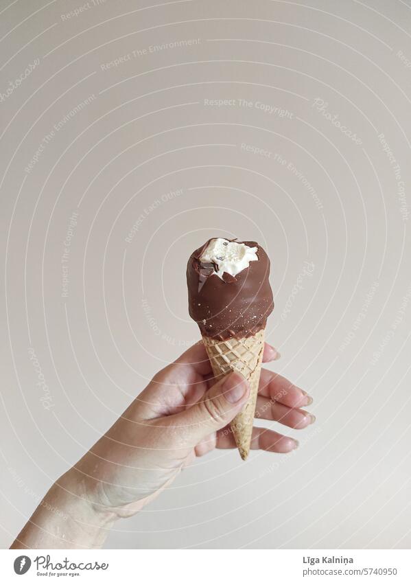 Hand holding an ice-cream cone Ice cream Delicious Eating Ice cream ball Refreshment Candy Ice-cream cone Dessert Nutrition Food Summer Chocolate Cone