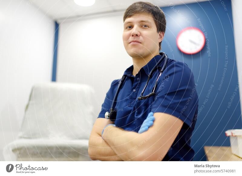 Portrait of general practitioner in medical office during appointment of patient. doctor portrait family looking at camera gp physician clinic hospital